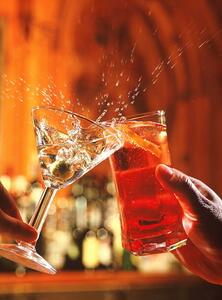 Photography Couple clinking glasses, spilling drink, close-up, Peter Dazeley