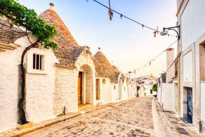 Photography Famous Trulli Houses during a Sunny, roman_slavik