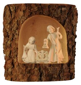 Holy family in wooden log