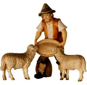Shepherd feeding two sheep - Folk