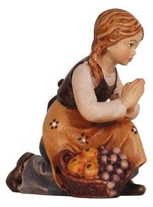 Girl kneeling for Nativity scene - Homeland