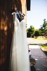 Art Photography Beautiful white wedding dress hanging elegantly, Wirestock, (26.7 x 40 cm)