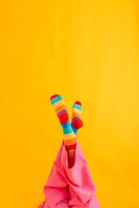 Photography Woman wearing colorful socks against yellow, Westend61, (26.7 x 40 cm)