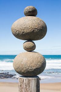 Photography Tower of rocks balancing on a wooden pole, Dimitri Otis, (26.7 x 40 cm)