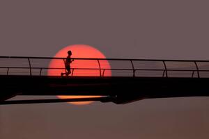 Art Photography Man out for morning run over bridge., Grant Faint, (40 x 26.7 cm)