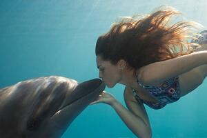 Photography Young Woman Kisses Dolphin Underwater, Sunbeams, Justin Lewis, (40 x 26.7 cm)
