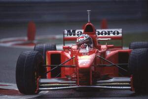 Photography Michael Schumacher in a Ferrari F310B at the Belgian GP, Spa Francorchamps, Belgium, 1997, (40 x 26.7 cm)