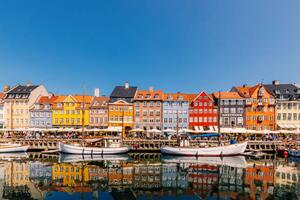 Photography Multi-colored vibrant houses along Nyhavn harbour, Alexander Spatari