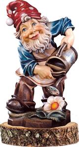 Gnome gardener on a wooden pedestal