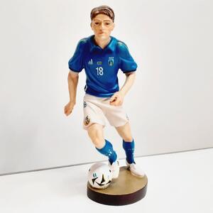 Football player wooden statue