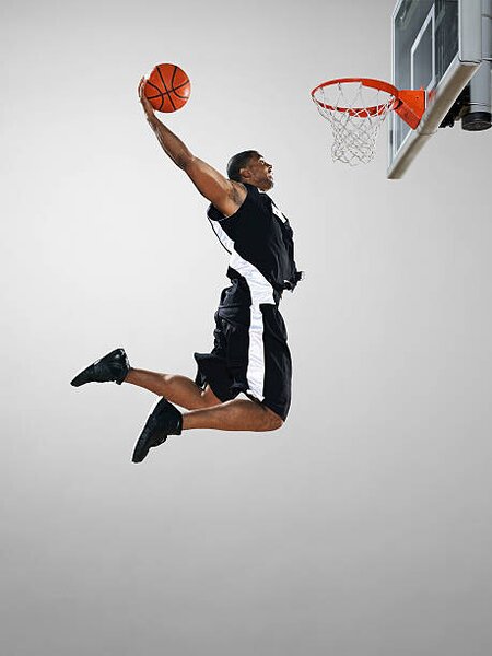 Photography Basketball player dunking ball, low angle view, Blake Little