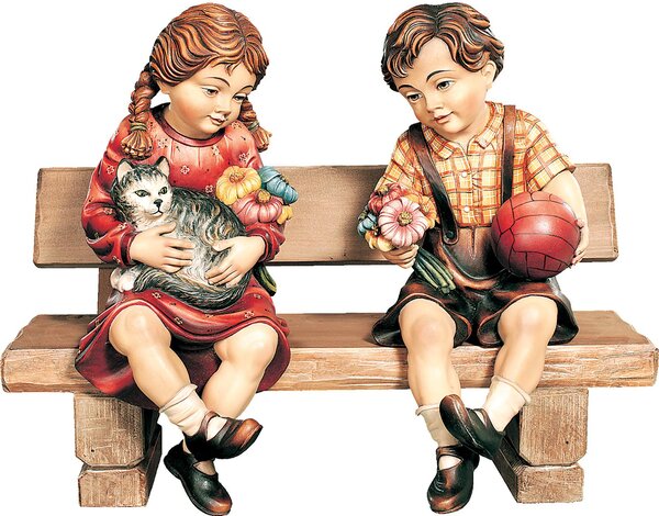 Boy and girl sitting on a bench