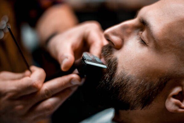 Photography Man getting his mustache shaped by, EXTREME-PHOTOGRAPHER