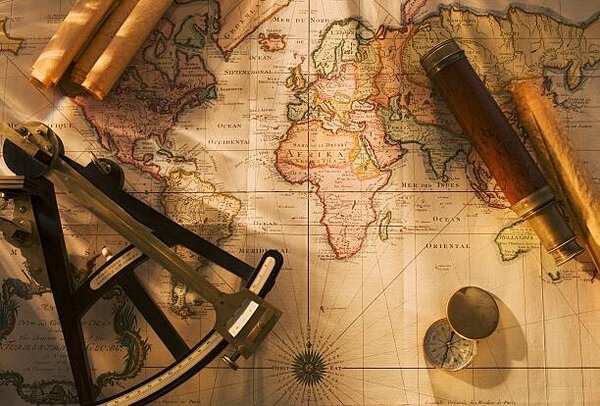 Photography Octant, compass and telescope on nautical map, Tetra Images