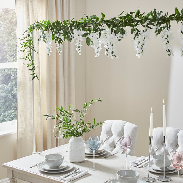 Artificial White Hanging Plan Over Table Display