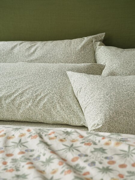 Mellow Green Standen Cotton Pillowcases (Pair) | Standard | Piglet in Bed