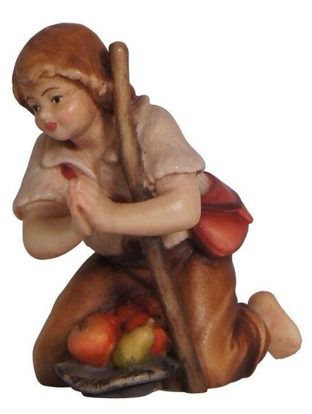 Boy kneeling with stick for Nativity scene - Homeland