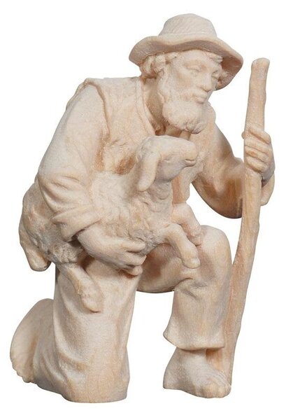 Shepherd kneeling with lamb in his arms for Nativity scene - Alpine