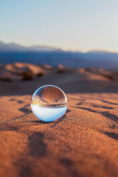 Art Photography Glass Sphere on Desert Sand, Lena Wagner, (26.7 x 40 cm)