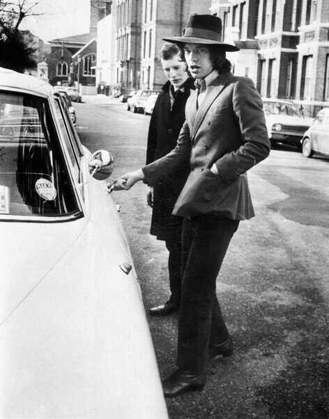 Photography Jagger, singer with the Rolling Stones, about to get into his car, c.1970