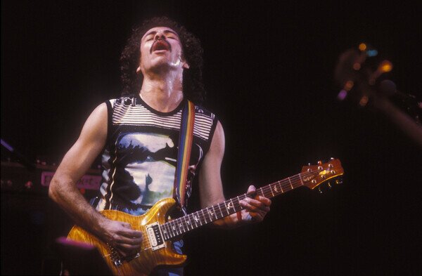 Photography Guitarist Carlos Santana on stage., 1985